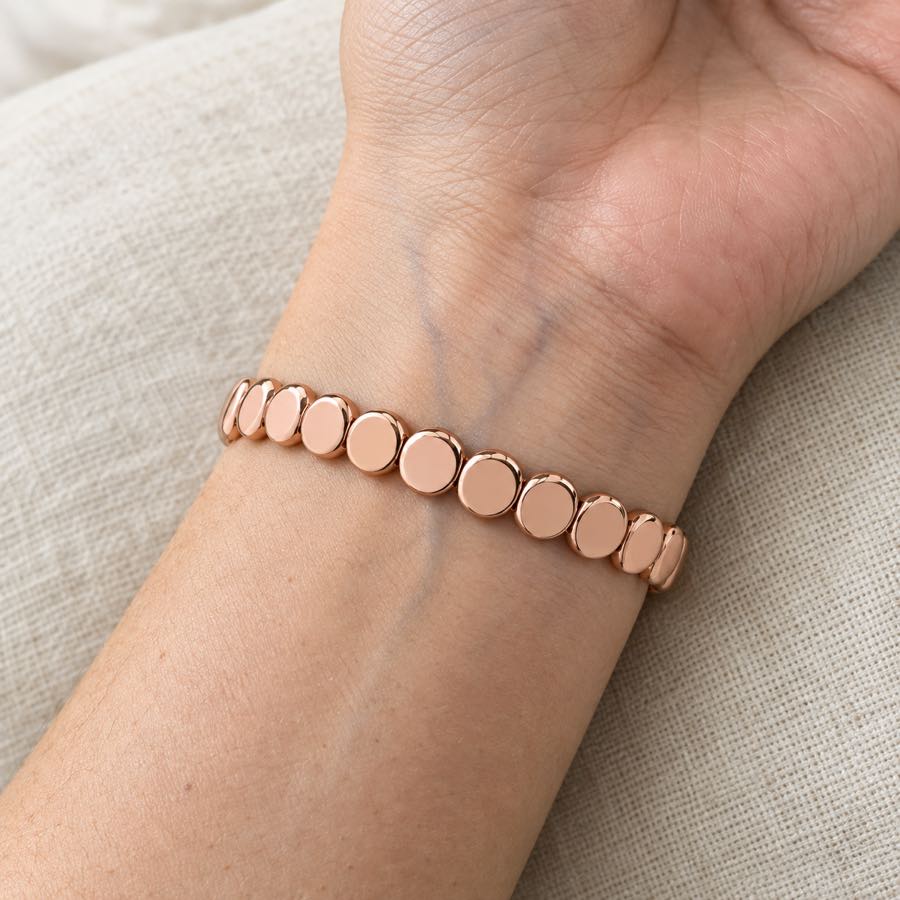 The HAIMA rose gold bracelet worn snug on the inner wrist